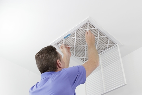 man changing an hvac air filter